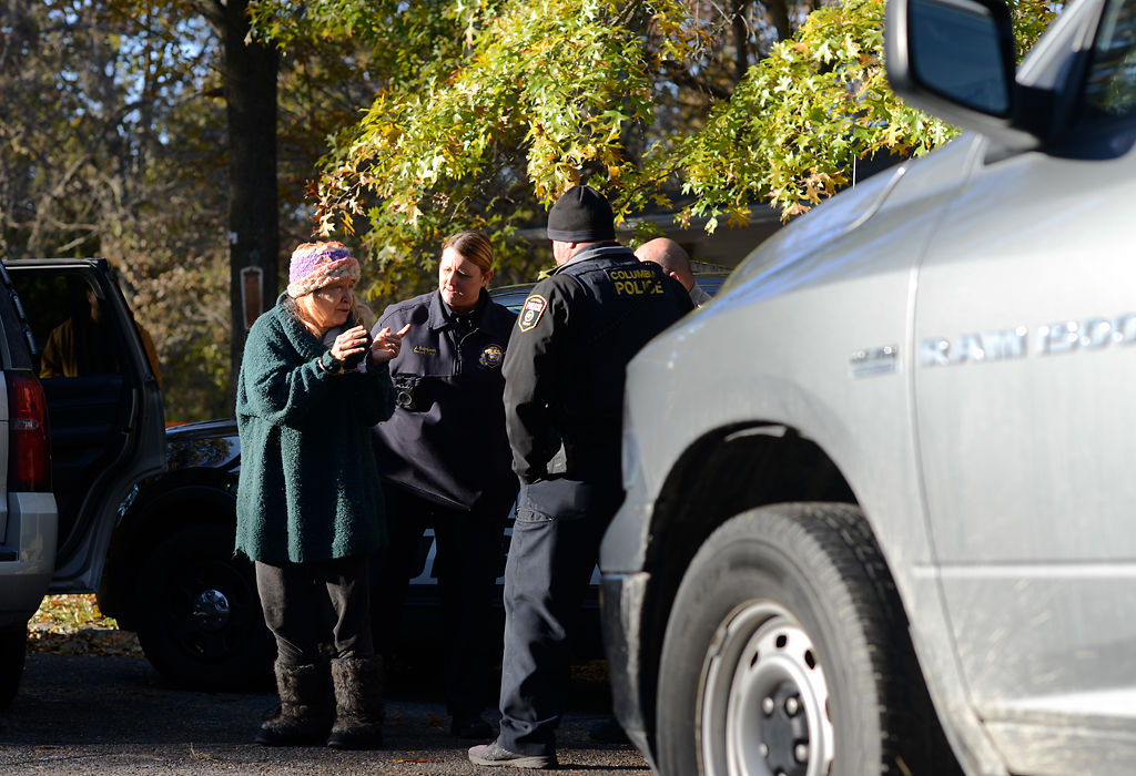 Sutu Forté is escorted into a Boone County Sheriff's Office vehicle
